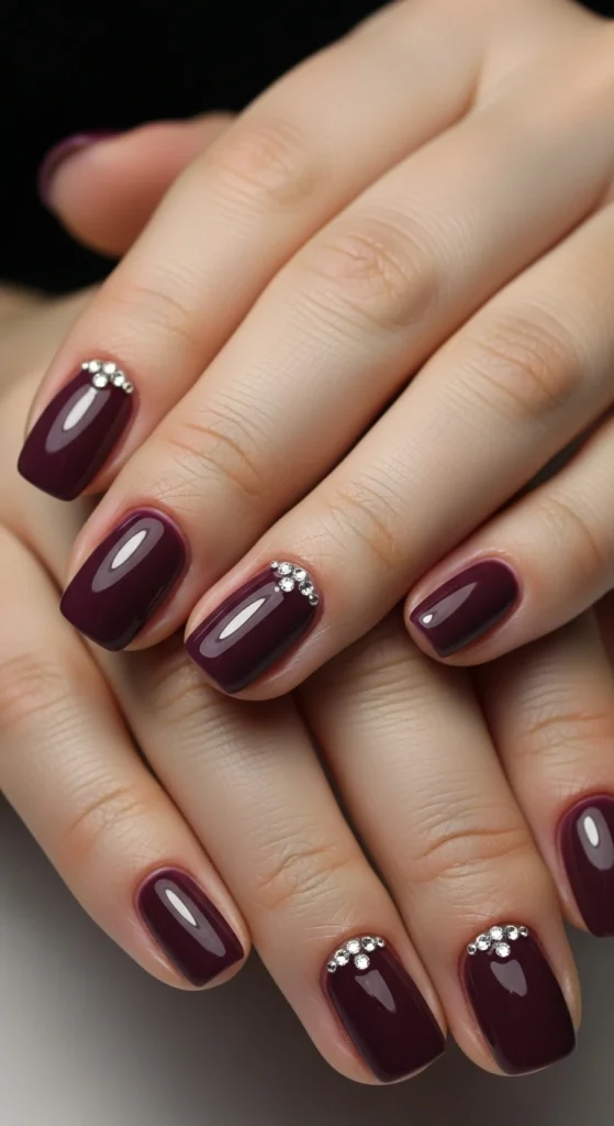 Deep Aubergine Nails with Rhinestone Accents